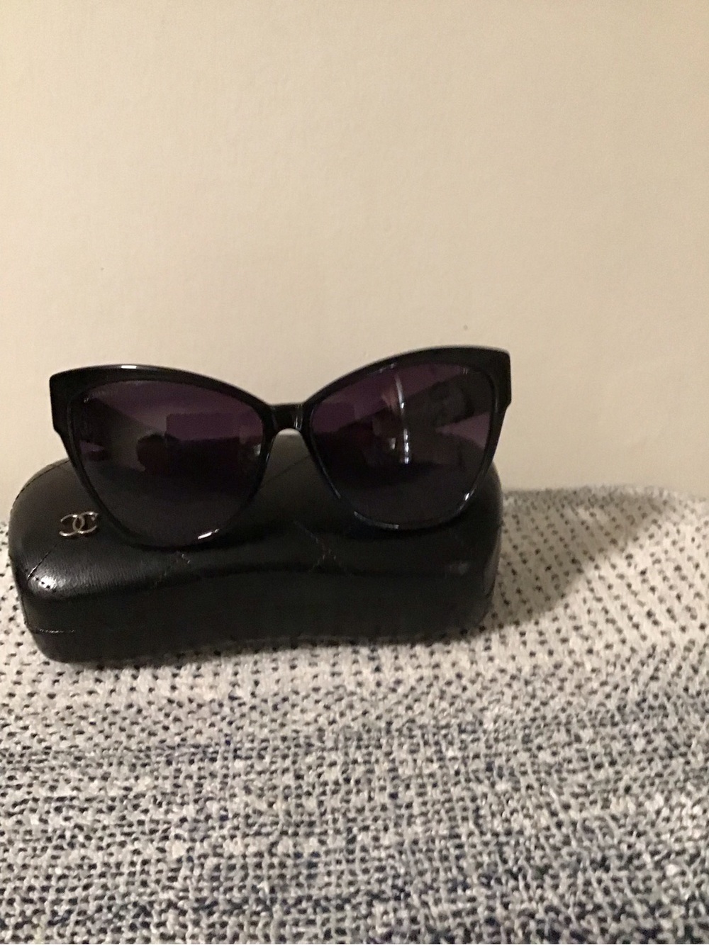 CHANEL Black Cat-Eye Sunglasses with Purple Lenses